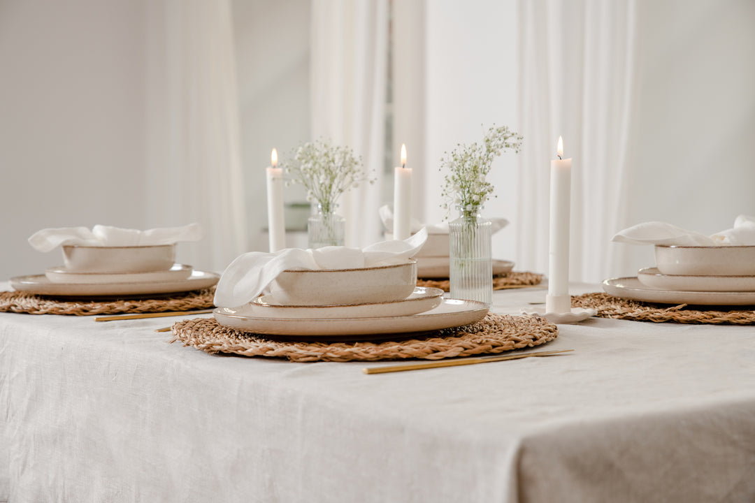 Crafted from 100% natural flax fibers sourced from Europe, this tablecloth is not only sustainable and eco-friendly, but also has a unique texture and softness #color_natural-linen