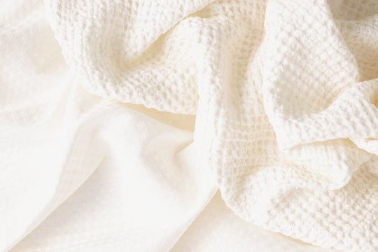 Luxurious waffle throw blankets for bed make of linen #color_white